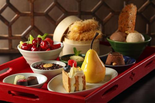 a tray filled with different types of desserts at Grand Hyatt Beijing in Beijing