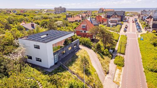 an image of a house with solar panels on its roof at Villa Sea breeze in Bergen aan Zee