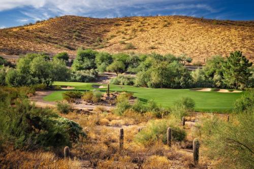 a golf course with a mountain in the background at Hilton Phoenix Tapatio Cliffs Resort in Phoenix