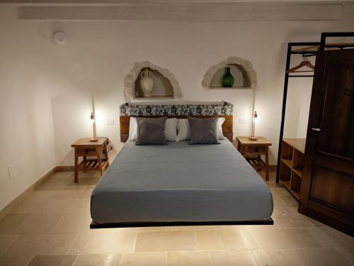 Postel nebo postele na pokoji v ubytování Trulli-eu Guesthouse Alberobello