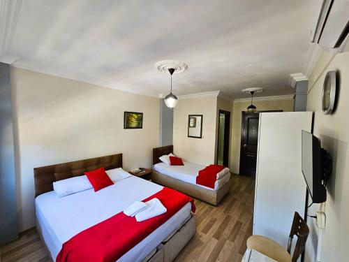 Ένα ή περισσότερα κρεβάτια σε δωμάτιο στο SULTAN SARAY OTEL