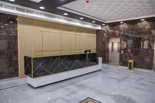 a large lobby with acision at itten plaza blue in Salalah