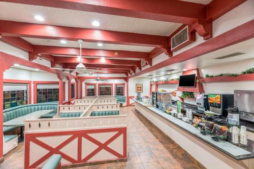 a fast food restaurant with red walls and a counter at Quality Inn Payson in Payson