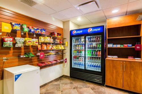 a soda shop with a soda machine in a store at Comfort Suites in Gothenburg