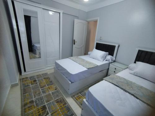 En eller flere senge i et værelse på Alex Panoramic seaview