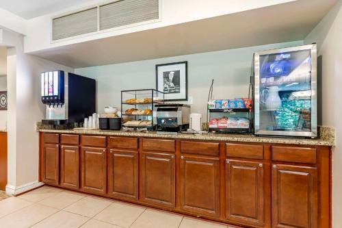 a kitchen with a counter with a refrigerator at Country Inn & Suites by Radisson, Annapolis, MD in Annapolis