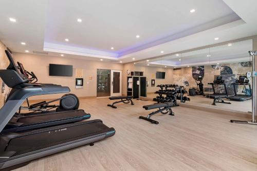 a fitness room with treadmills and exercise equipment at Cambria Hotel North Conway in North Conway