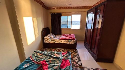 Ένα ή περισσότερα κρεβάτια σε δωμάτιο στο Super Elite apartment Nile View F9