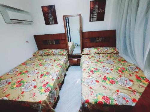 Postel nebo postele na pokoji v ubytování الإمارات هايتس North Coast