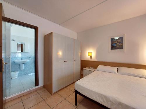 Postel nebo postele na pokoji v ubytování Hotel Nettuno