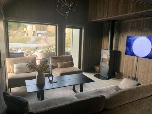 Et opholdsområde på Norefjell, Ny og flott hytte 4 soverom