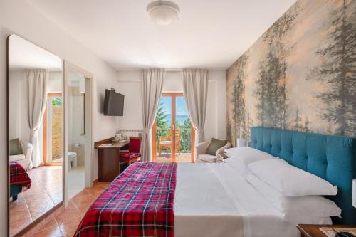 Postel nebo postele na pokoji v ubytování Hotel Rasinus