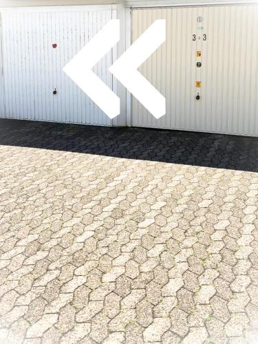 a wall with two x signs on the side of a building at Panoramameerblicksuite direkt am Strand, Garage Wlan, Aufzug, Smarttv,Bettwäsche,Handtücher, Netflix uvm in Cuxhaven