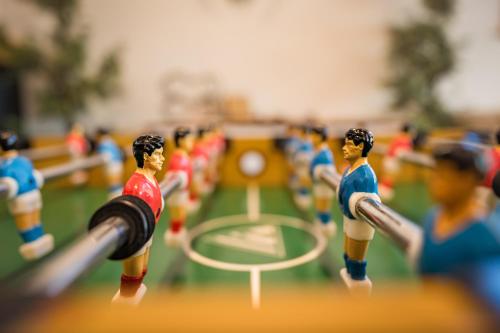 a toy group of toy people playing with a rugby ball at Coppermoon Cabin in Broken Bow