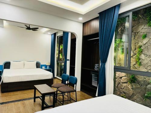 Una cama o camas en una habitación de Pearl Hotel Phu Quoc