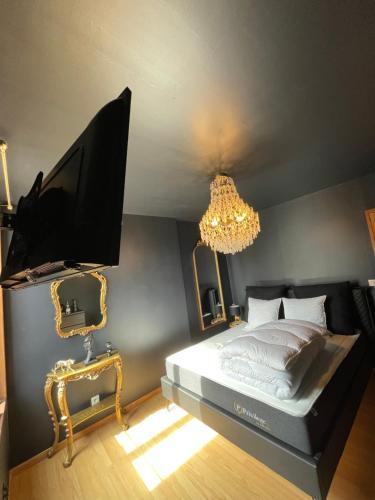 Letto o letti in una camera di Maison Spacieuse Jacuzzi Wifi Netflix