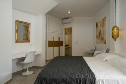 A bed or beds in a room at Mikri Sorriso - Luxurious Villa On The Beach