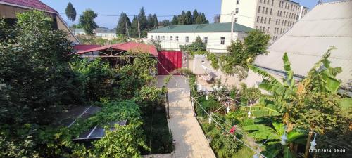 an overhead view of a city with buildings and trees at Kuki house in Ganja