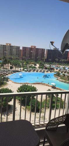 a view of a water park from a balcony at شاليه بورتو جولف in Abû Zeira