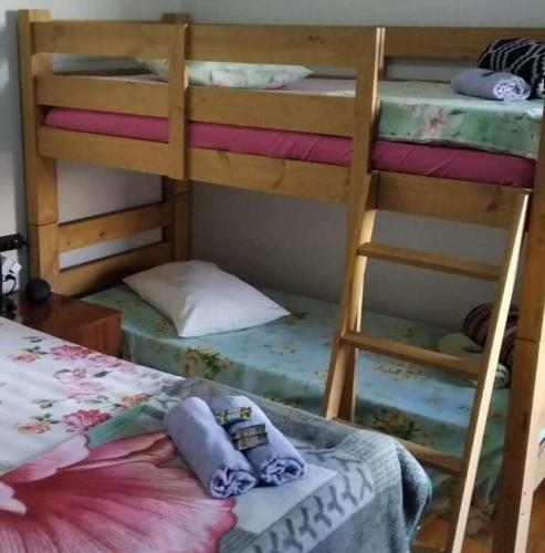 a bedroom with two bunk beds and a bed at Pousada Seu Jorge in Campinas