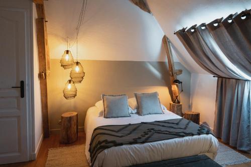 Postel nebo postele na pokoji v ubytování Lavandières