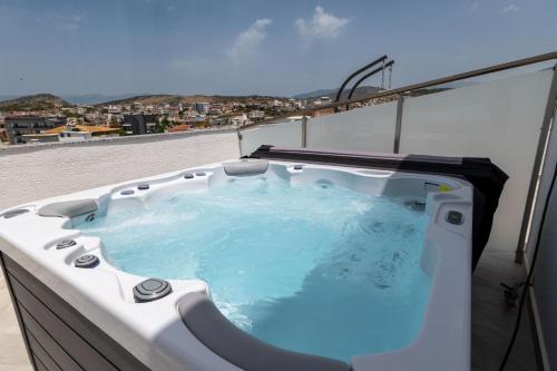 a hot tub on the roof of a building at Duka's Hotel in Ksamil