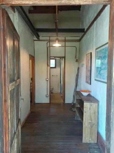 an empty hallway of an old building with a wooden floor at Casa Nati in Casale di Pari