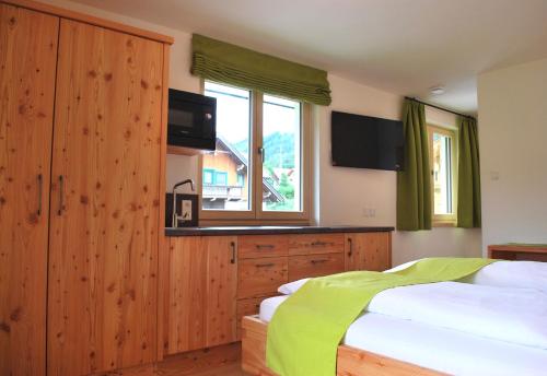 a bedroom with two beds and a window at Hinkerhof in Schladming