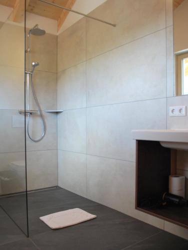 a bathroom with a shower and a sink at Hinkerhof in Schladming