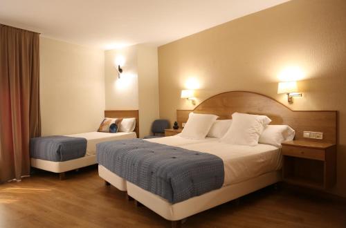 Ένα ή περισσότερα κρεβάτια σε δωμάτιο στο Hotel Maruxia *** Superior