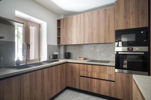 Η κουζίνα ή μικρή κουζίνα στο Plaka House - Boutique Apartments