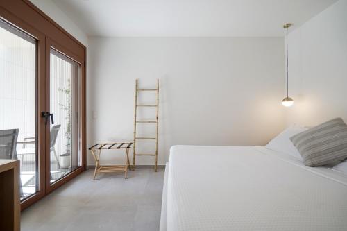 Ένα ή περισσότερα κρεβάτια σε δωμάτιο στο Plaka House - Boutique Apartments