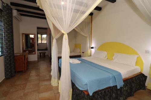 Postel nebo postele na pokoji v ubytování Makuti Villas Resort
