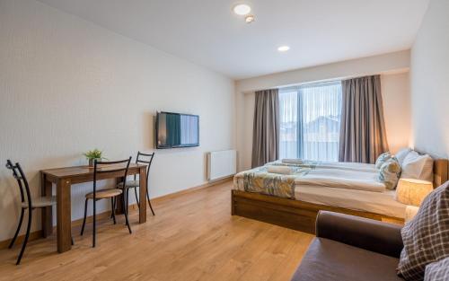 Postel nebo postele na pokoji v ubytování New Gudauri NG Rooms