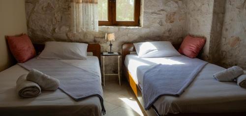 Ένα ή περισσότερα κρεβάτια σε δωμάτιο στο Fterini Apartments Sterna & Alletri