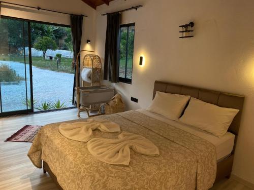 Postel nebo postele na pokoji v ubytování Zirkon Valley Boutique Hotel
