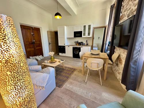 a living room with a couch and a table at GORGEOUS BRAND NEW 2 BEDROOMS in Antibes