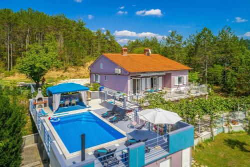 an aerial view of a house with a swimming pool at Holiday house Grace in Cerovlje