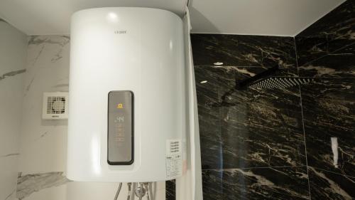 a white appliance sitting on top of a counter at Circle Tirana City Center in Tirana