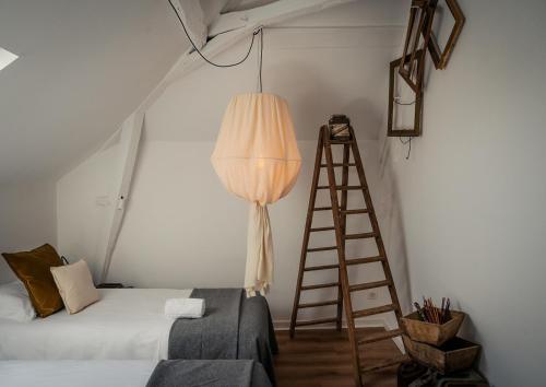 Postel nebo postele na pokoji v ubytování Le Charron de Sancerre