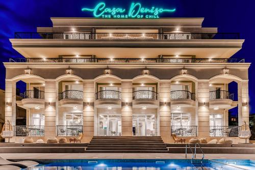 a large building with a pool in front of it at Casa Deniso - The Home of Chill in Byala