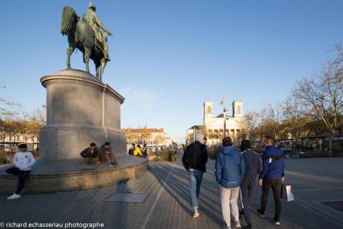 a group of people standing around a statue at Hôtel de la Vendée in La Roche-sur-Yon