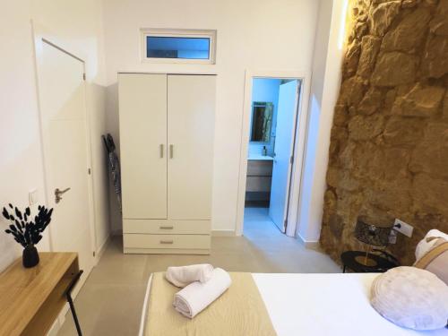 Ένα ή περισσότερα κρεβάτια σε δωμάτιο στο Carolinas Suites by Coqueto