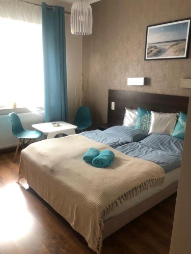 Postel nebo postele na pokoji v ubytování Azzurro