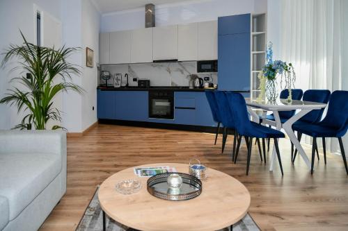 a living room with a couch and a table at Hata Luxury Apartments in Shkodër