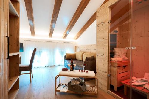 a living room with a couch and a table at La Filanda Relax&Gourmet in Denno