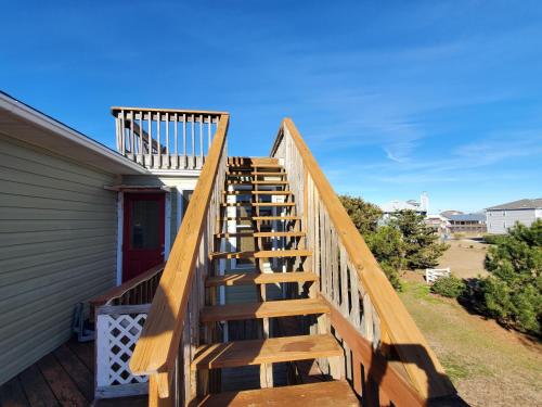 a wooden staircase leading up to a house at Barney's Roost in Sanderling