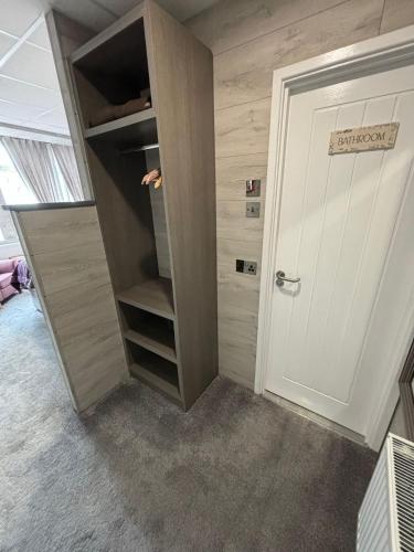 a room with a closet with a door open at Kings Boutique Hotel in Blackpool