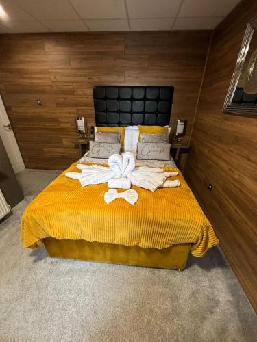 a bedroom with a bed with towels on it at Kings Boutique Hotel in Blackpool
