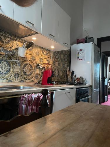 a kitchen with a counter top and a refrigerator at Residenza del Castello di Fornelli in Fornelli